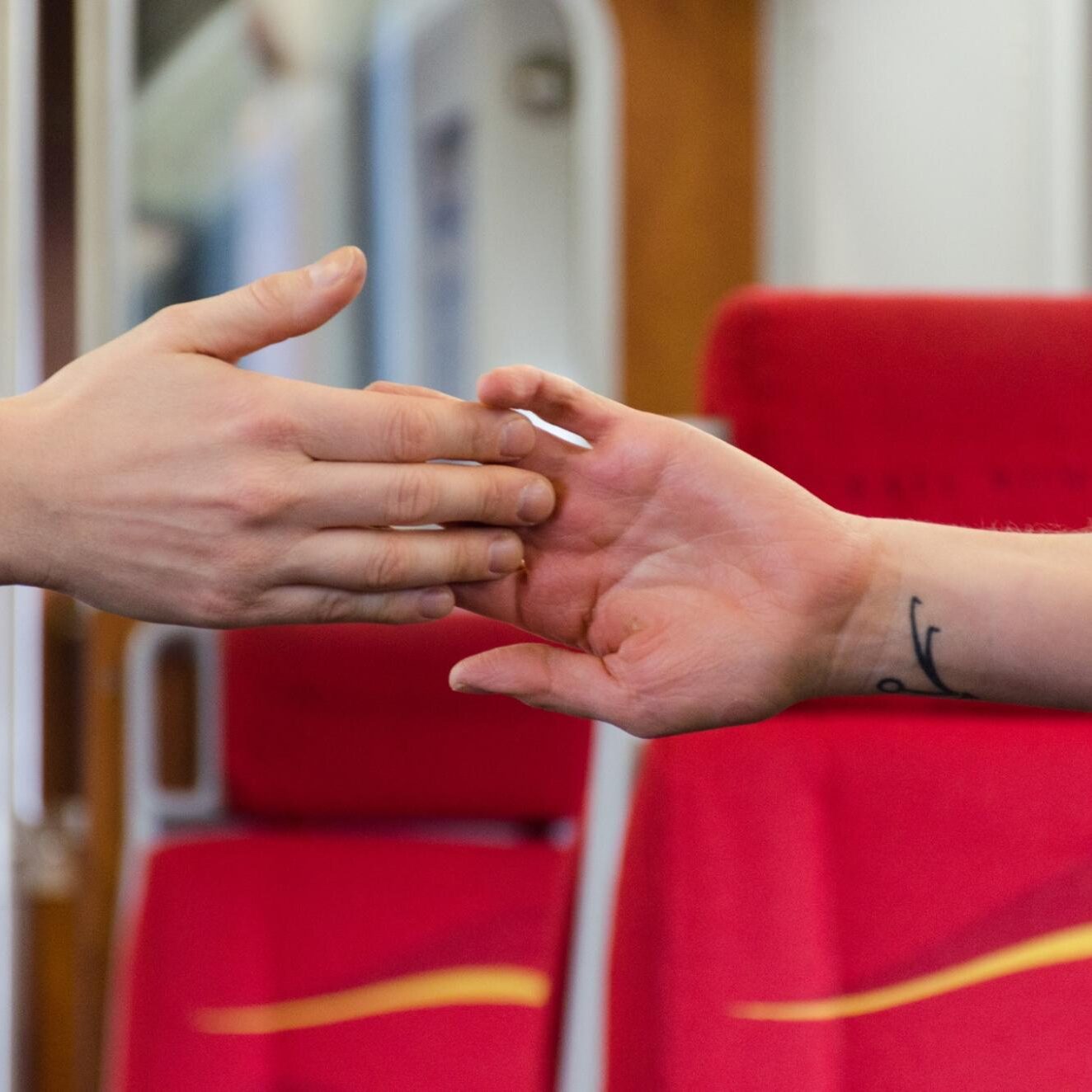 Dancers touching hands